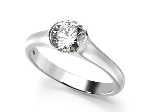 Handmade platinum side set diamond engagement ring.